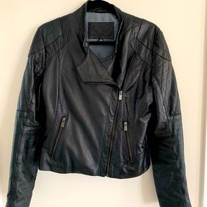 Very cute and trendy leather jacket. It is medium size and black colour.